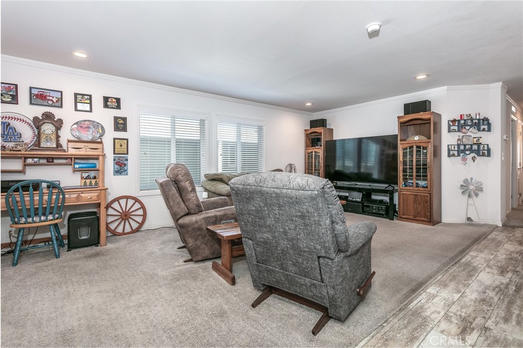18 Portola Road San Fernando, CA 91345 - Photo 11 of 21 a living room with furniture and a flat screen tv