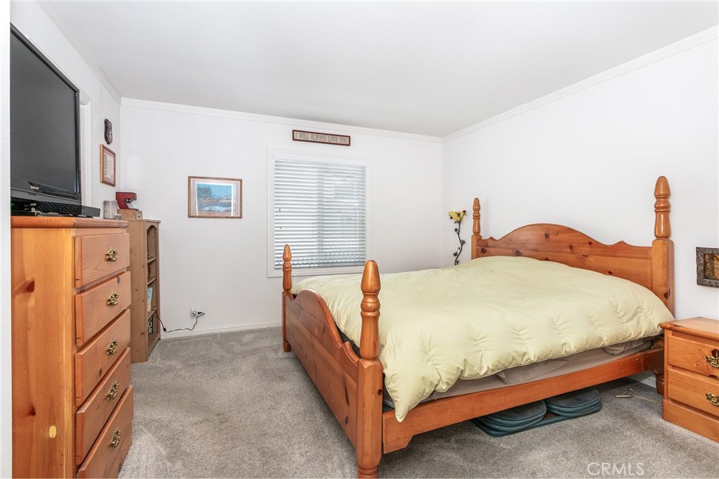 18 Portola Road San Fernando, CA 91345 - Photo 14 of 21 a bed room with a bed and a television