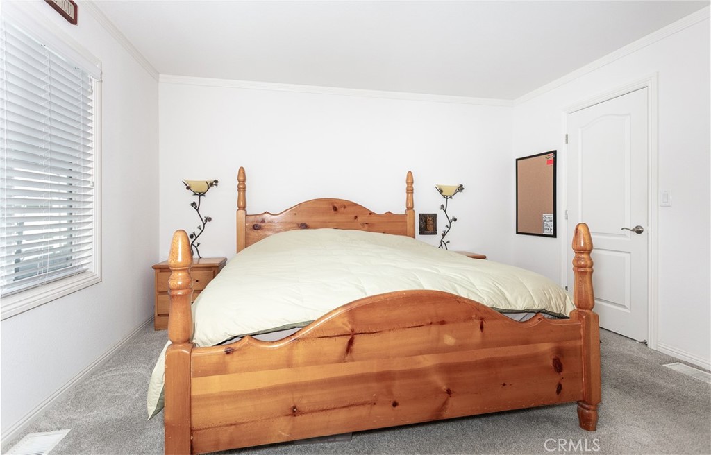 18 Portola Road San Fernando, CA 91345 - Photo 15 of 21 a bedroom with a bed and window