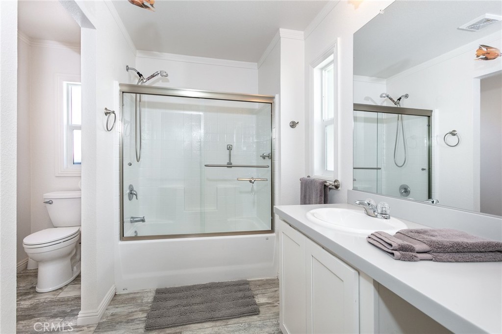 18 Portola Road San Fernando, CA 91345 - Photo 17 of 21 a bathroom with a sink a toilet and shower