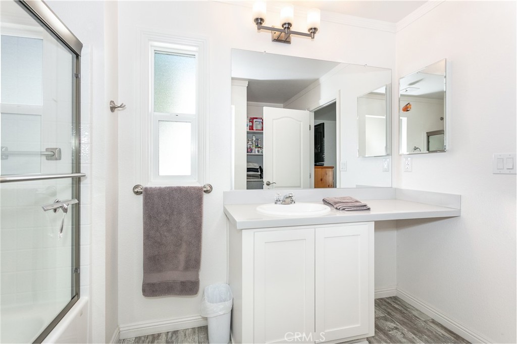 18 Portola Road San Fernando, CA 91345 - Photo 19 of 21 a bathroom with a sink and a mirror