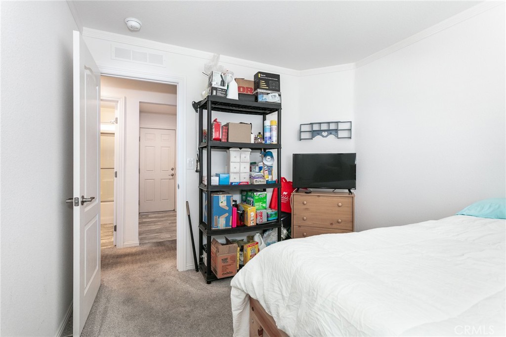 18 Portola Road San Fernando, CA 91345 - Photo 20 of 21 a bedroom with a bed and a television