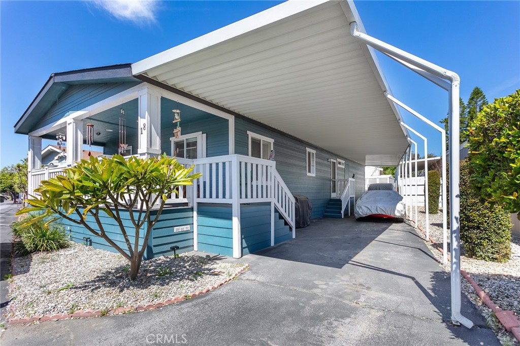 18 Portola Road San Fernando, CA 91345 - Photo 3 of 21 a view of a house with a yard and garage