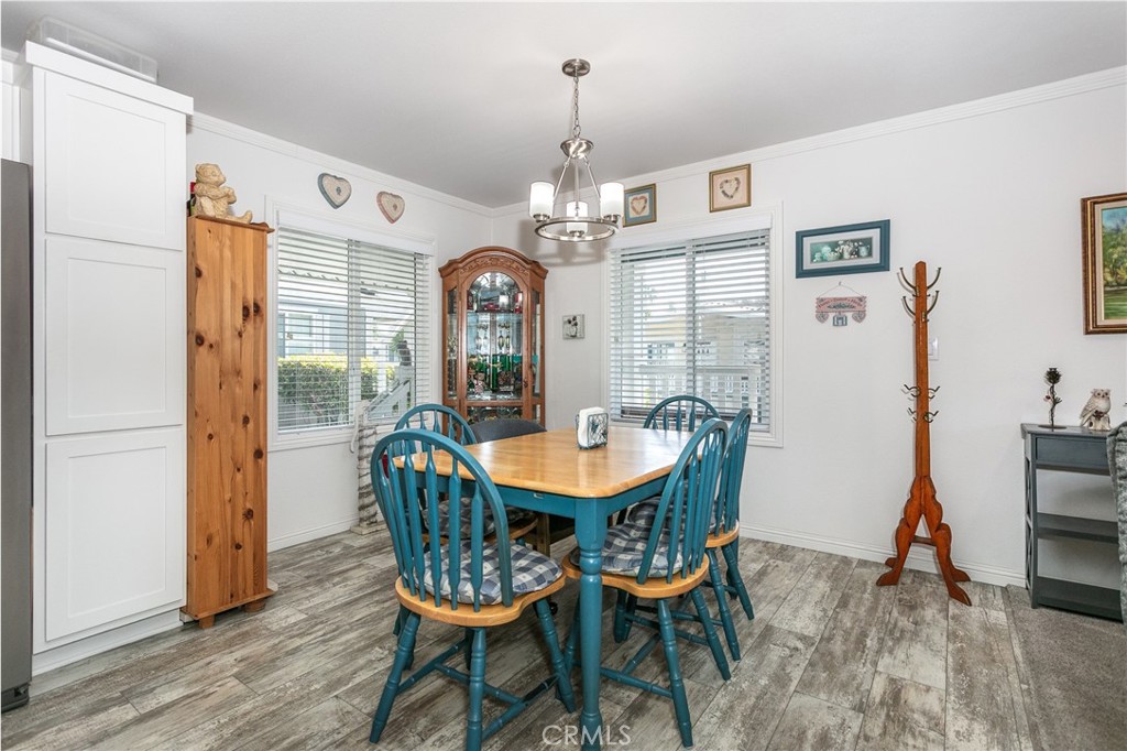 18 Portola Road San Fernando, CA 91345 - Photo 8 of 21 a dining room with furniture window and wooden floor