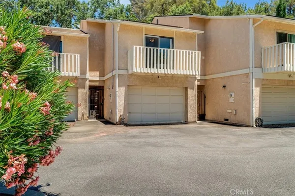 a front view of a house with a garage