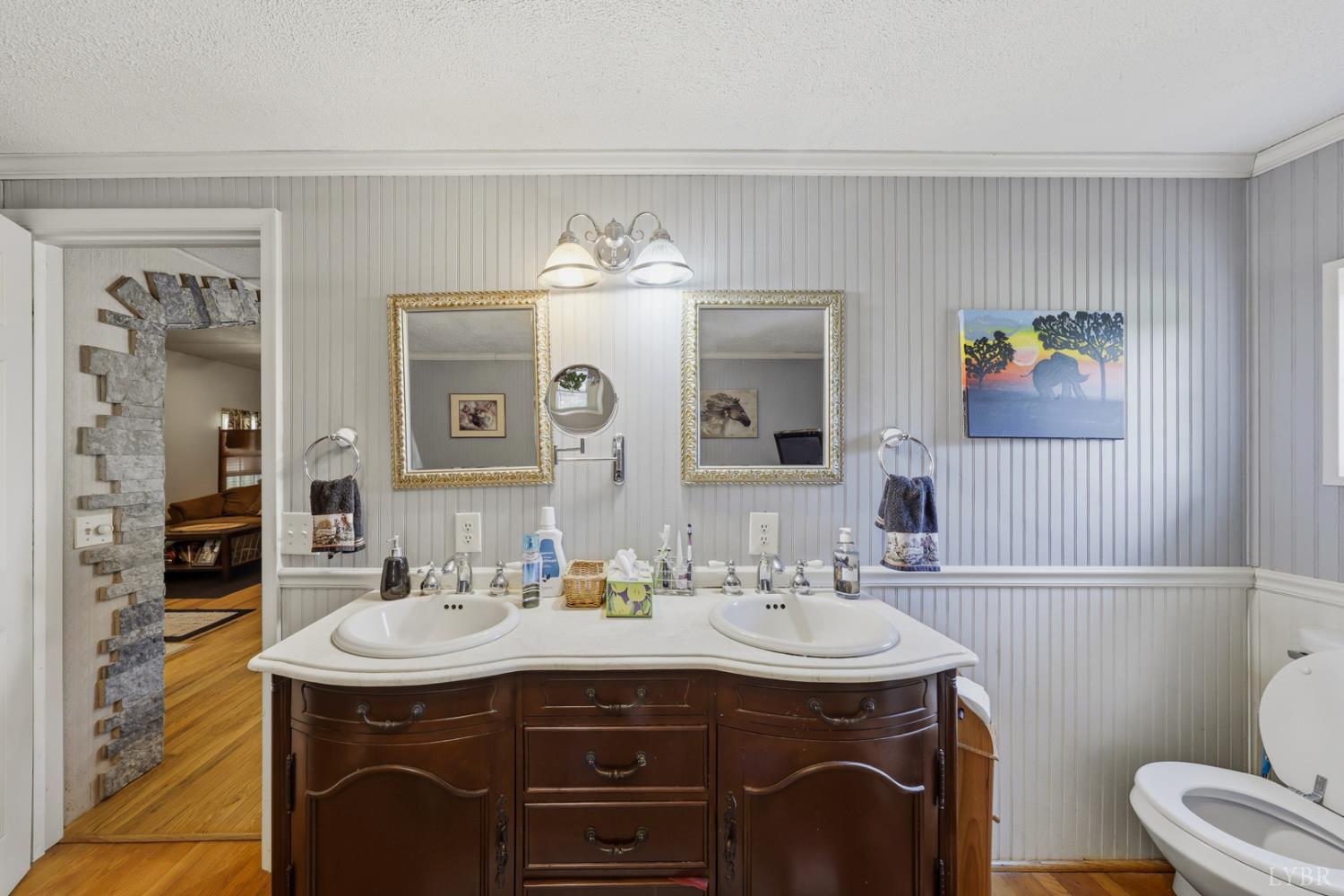 809 Plantation Road Amherst, VA 24521 - Photo 14 of 77 a bathroom with a sink and a mirror