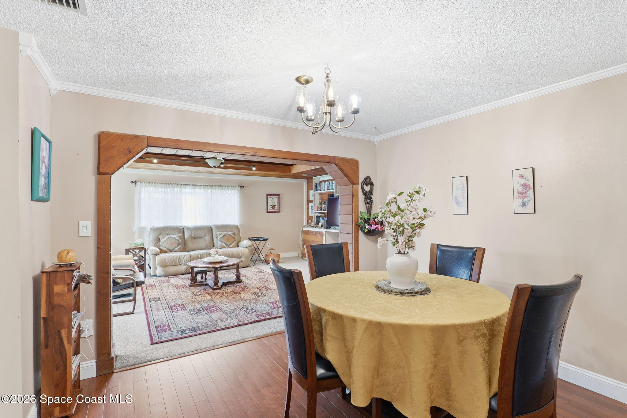908 Jefferson Road Rockledge, FL 32955 - Photo 6 of 37 a view of a dining room with furniture and wooden floor