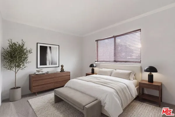 a bedroom with bed and window