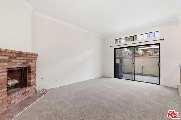 an empty room with fireplace