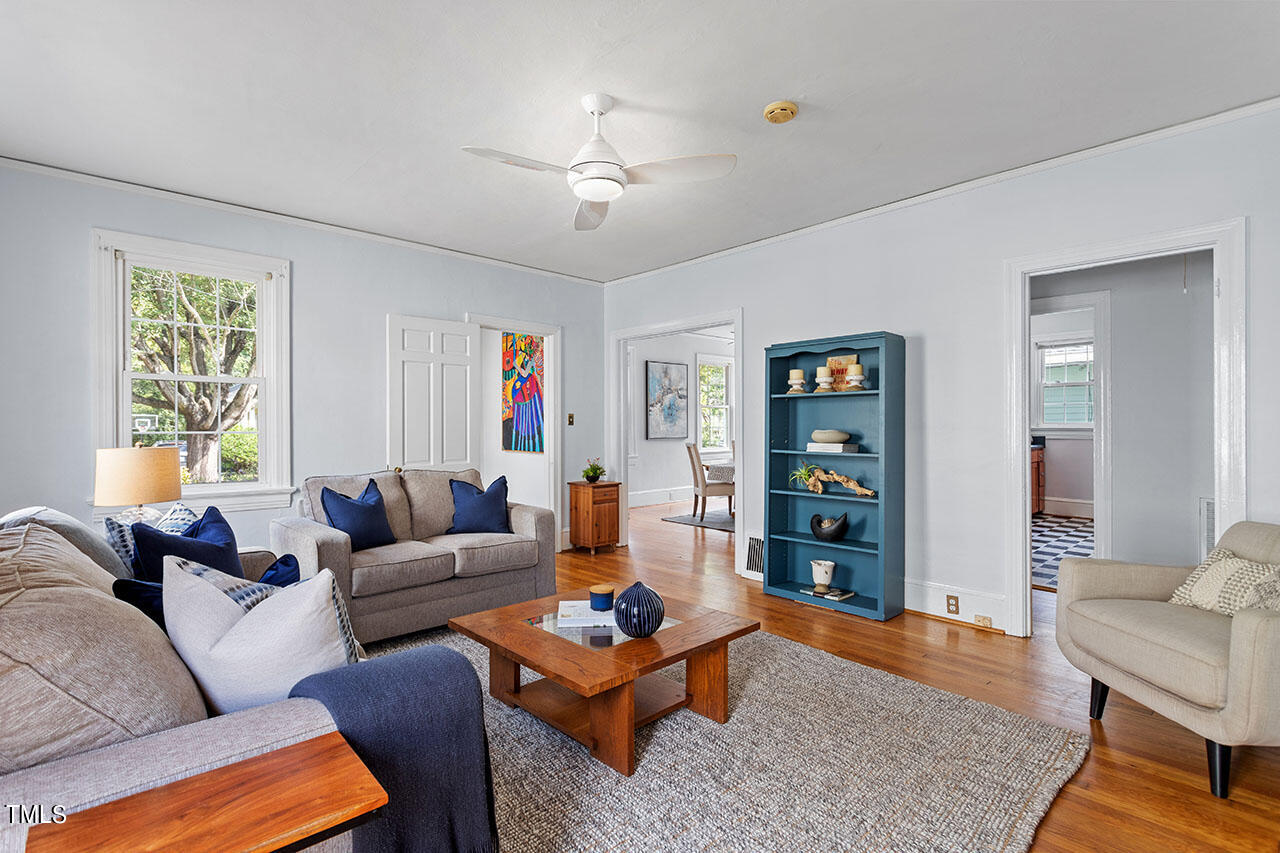 628 East Franklin Street Raleigh, NC 27604 - Photo 12 of 37 a living room with furniture a rug and a window