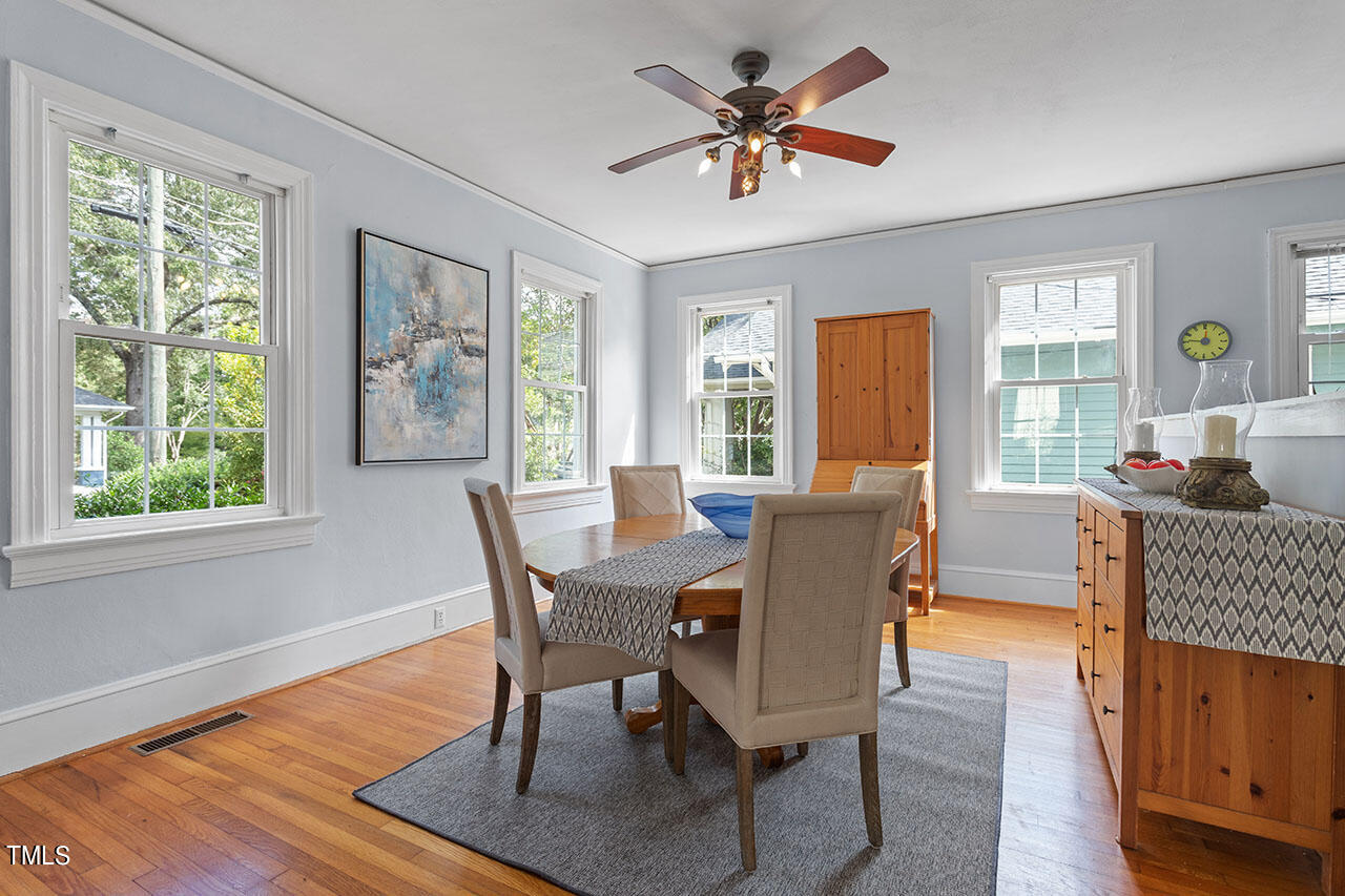 628 East Franklin Street Raleigh, NC 27604 - Photo 15 of 37 a dining room with furniture a livingroom view and wooden floor