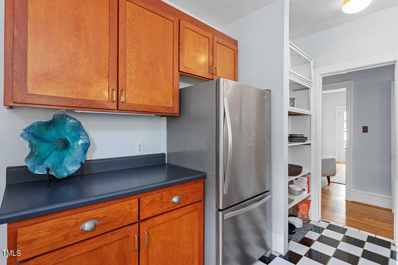 628 East Franklin Street Raleigh, NC 27604 - Photo 20 of 37 a kitchen with stainless steel appliances granite countertop a refrigerator and a sink