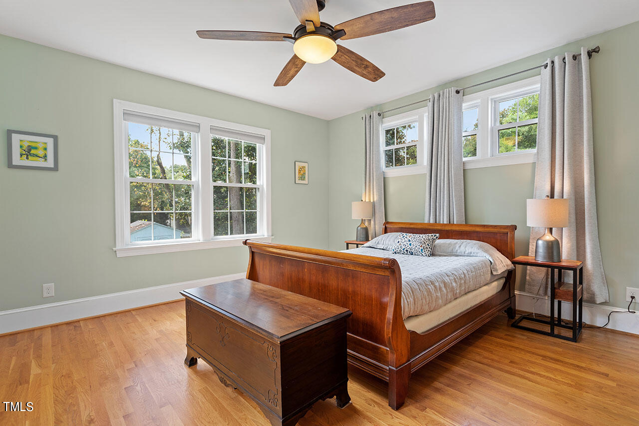 628 East Franklin Street Raleigh, NC 27604 - Photo 22 of 37 a bedroom with a bed and window