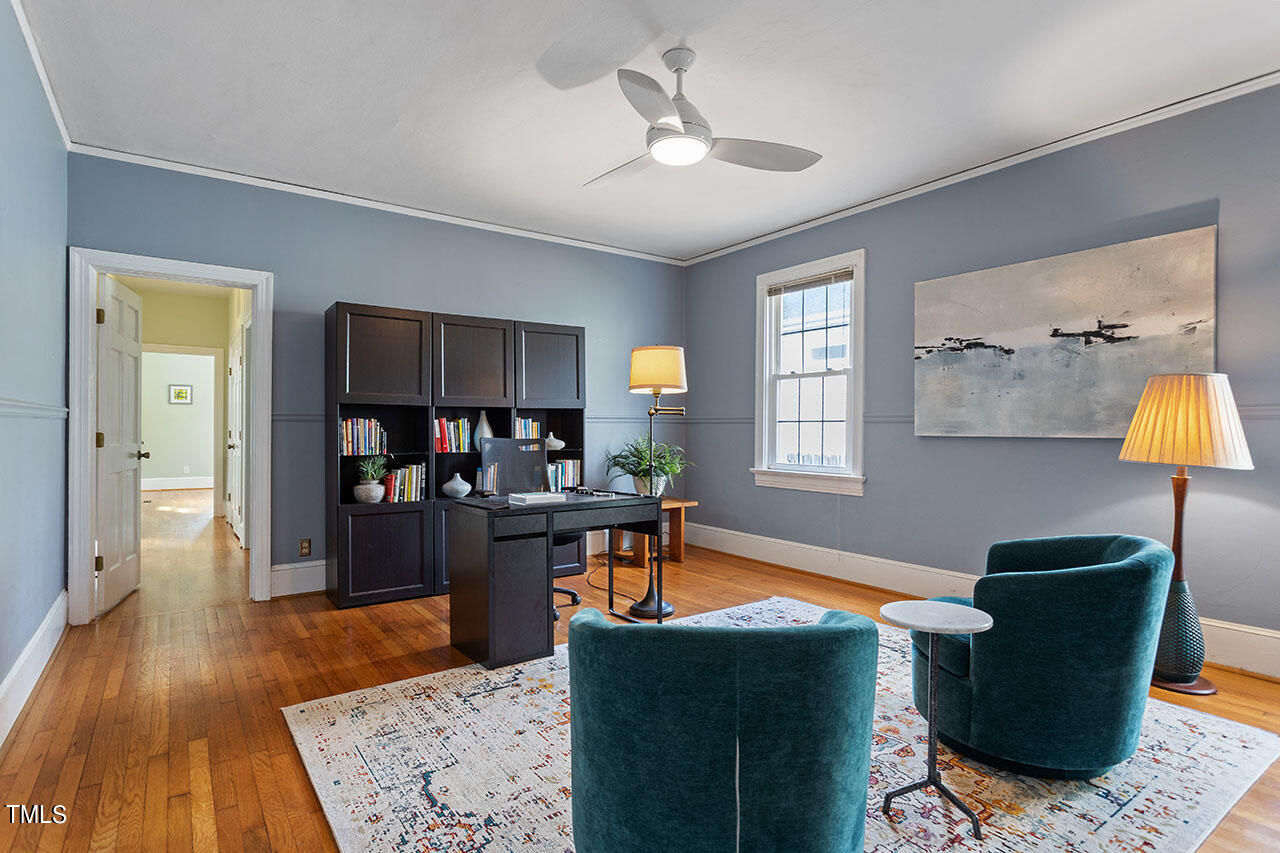 628 East Franklin Street Raleigh, NC 27604 - Photo 28 of 37 a living room with furniture and a wooden floor