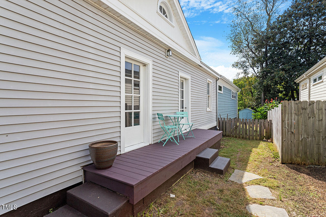 628 East Franklin Street Raleigh, NC 27604 - Photo 34 of 37 a view of a deck with wooden floor and a fence