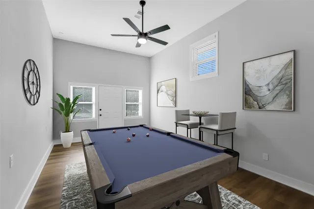 a view of a room with furniture and wooden floor