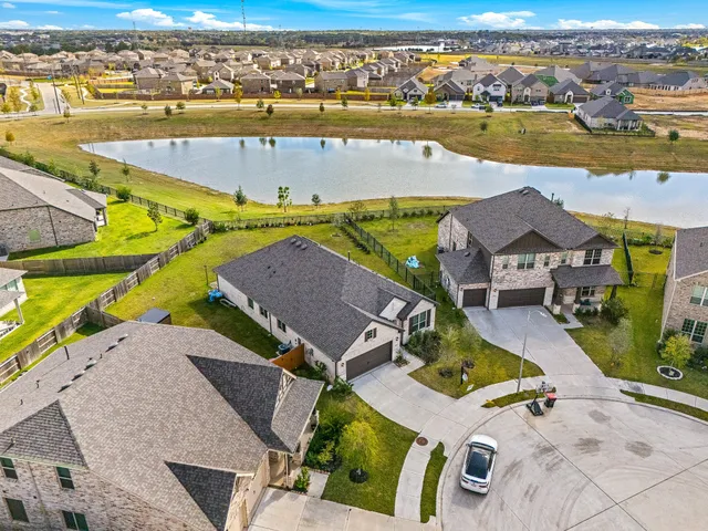 an aerial view of a house with a ocean view