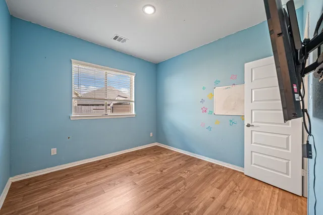 a view of a livingroom with wooden floor