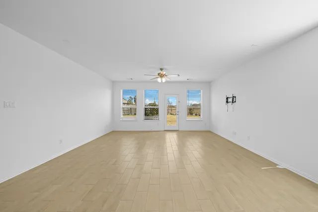 a large kitchen with stainless steel appliances granite countertop a large counter top and a stove