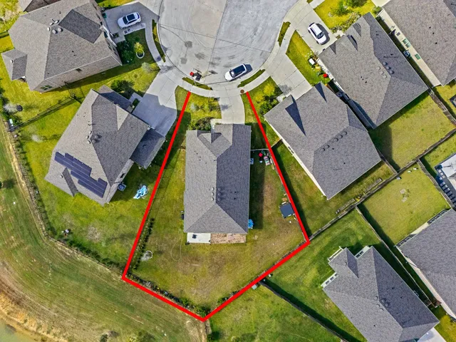 an aerial view of residential house with swimming pool