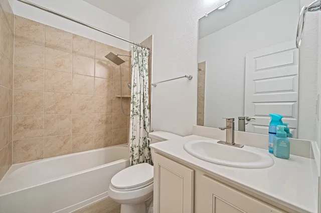 a bathroom with a sink a toilet and a bathtub