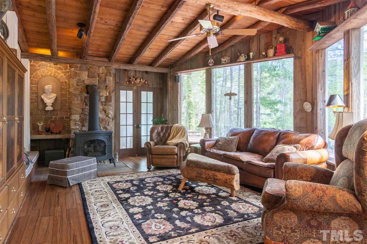 7018 Farmdale Road Raleigh, NC 27610 - Photo 19 of 25 a living room with furniture and a large window