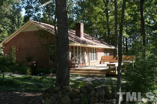 7018 Farmdale Road Raleigh, NC 27610 - Photo 3 of 25 a view of a house with backyard and sitting area