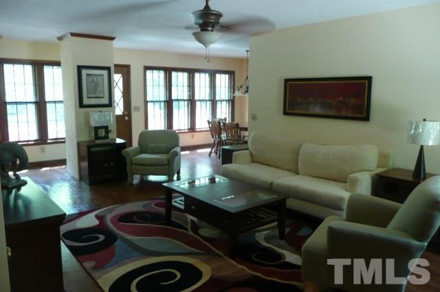 7018 Farmdale Road Raleigh, NC 27610 - Photo 5 of 25 a living room with furniture and a window
