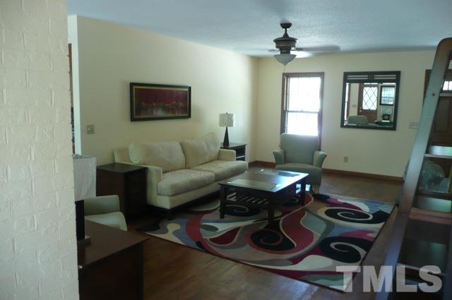 7018 Farmdale Road Raleigh, NC 27610 - Photo 6 of 25 a living room with furniture and a window