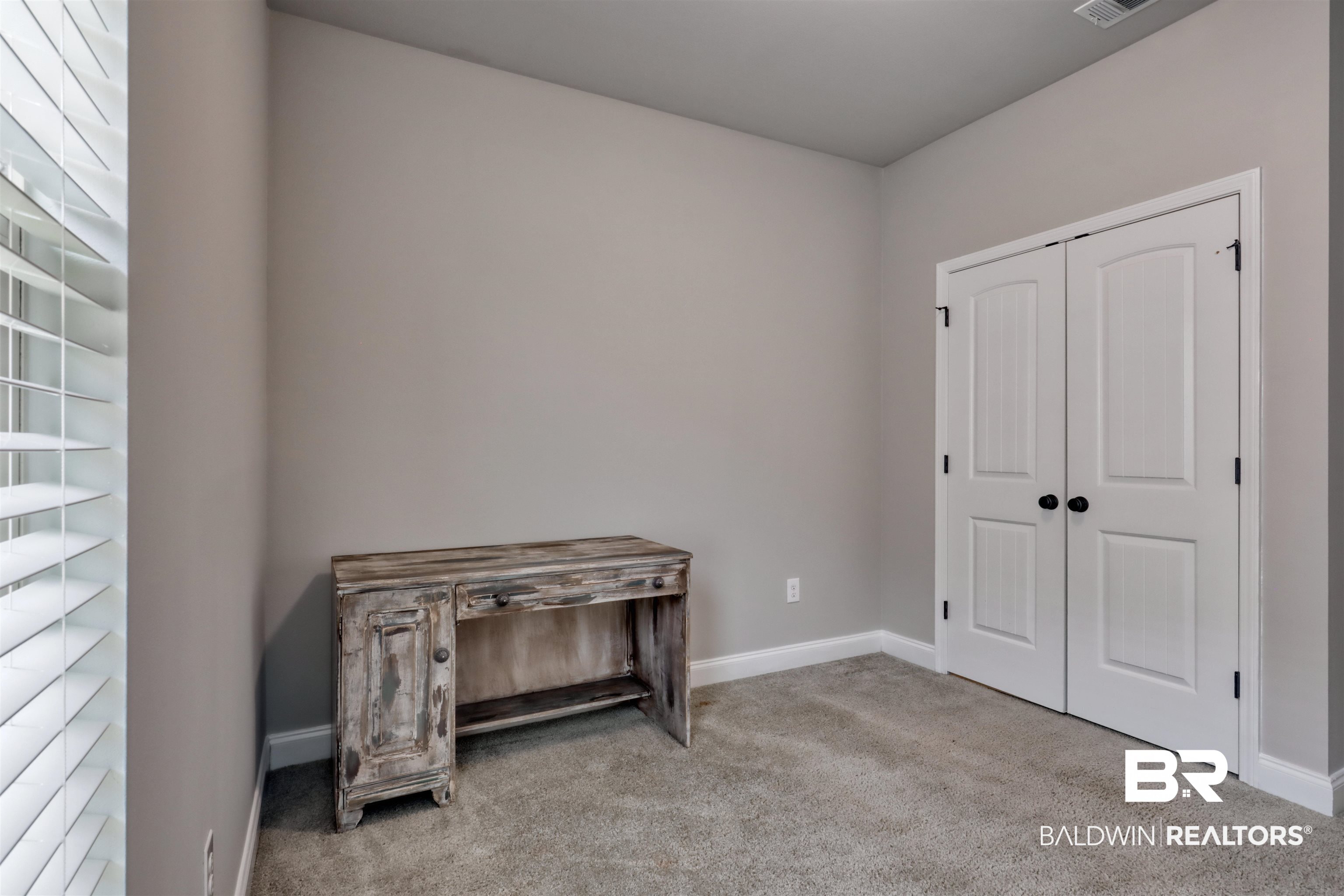 987 Gibson Court Foley, AL 36535 - Photo 22 of 34 Carpeted bedroom featuring baseboards, visible vents, and a closet