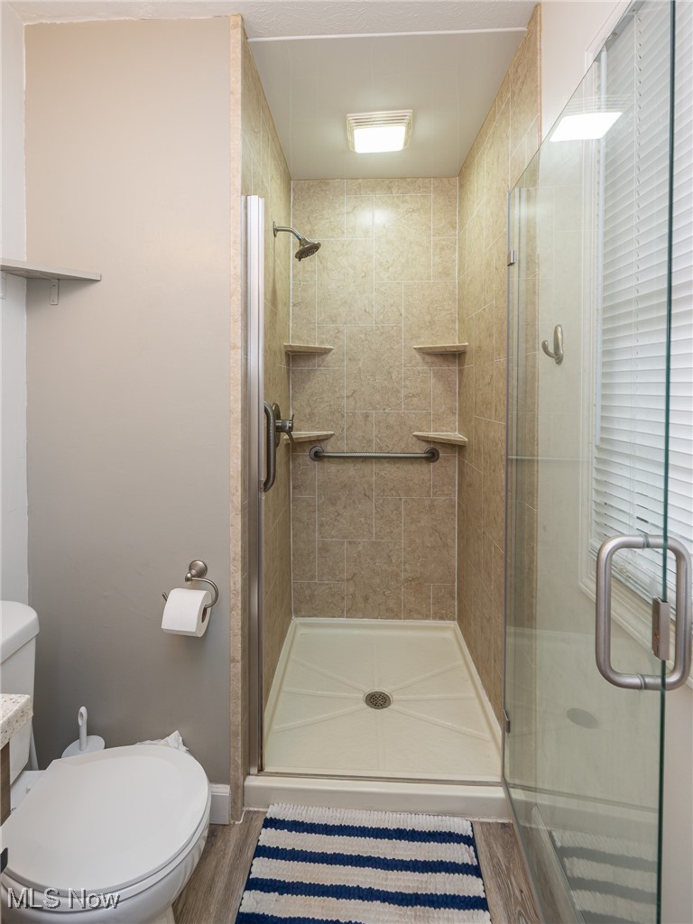 7711 Diagonal Road Kent, OH 44240 - Photo 27 of 45 Bathroom featuring a stall shower and light wood-style floors
