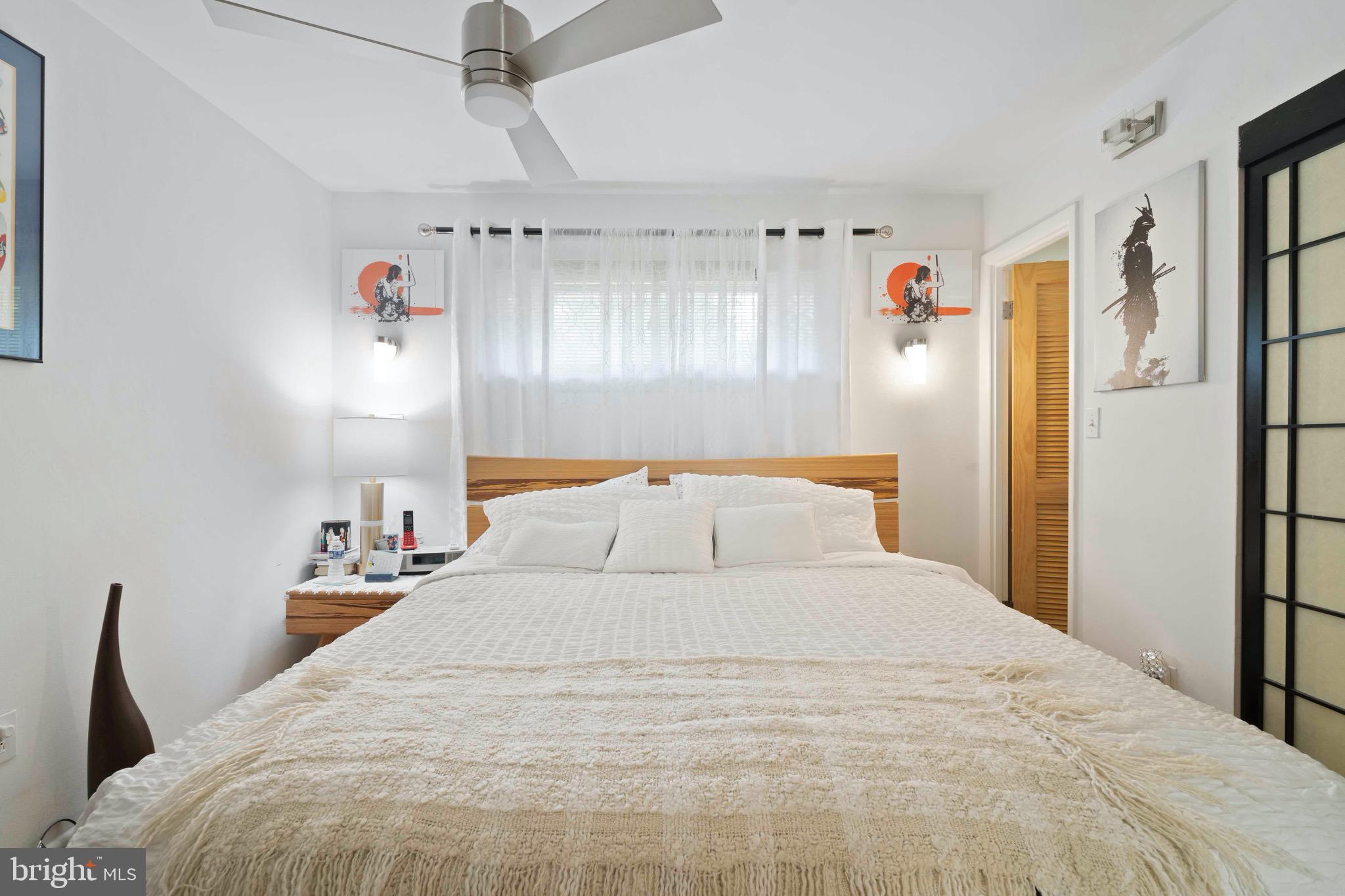 10832 Margate Road Silver Spring, MD 20901 - Photo 17 of 31 a large bed in a white room