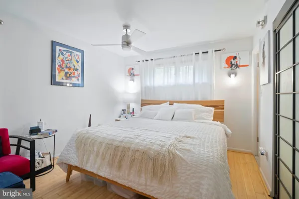 a bedroom with a bed and a table in it