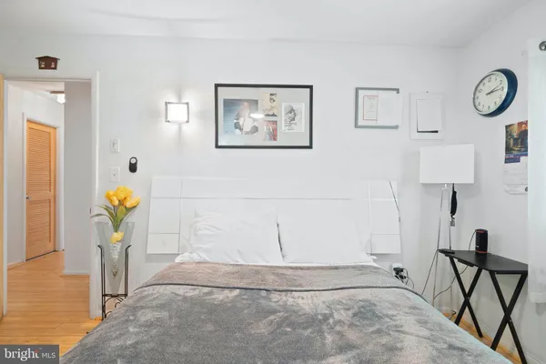 a view of a hallway with paintings on the wall