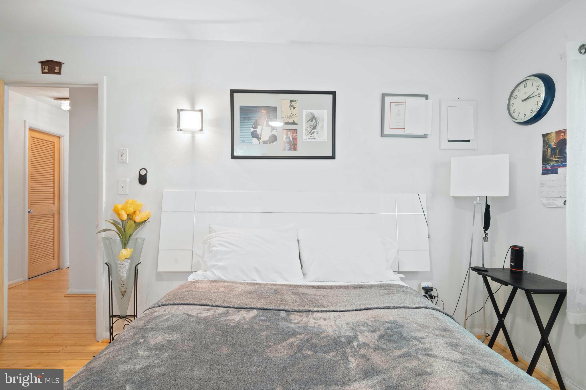 10832 Margate Road Silver Spring, MD 20901 - Photo 22 of 31 a view of a hallway with paintings on the wall