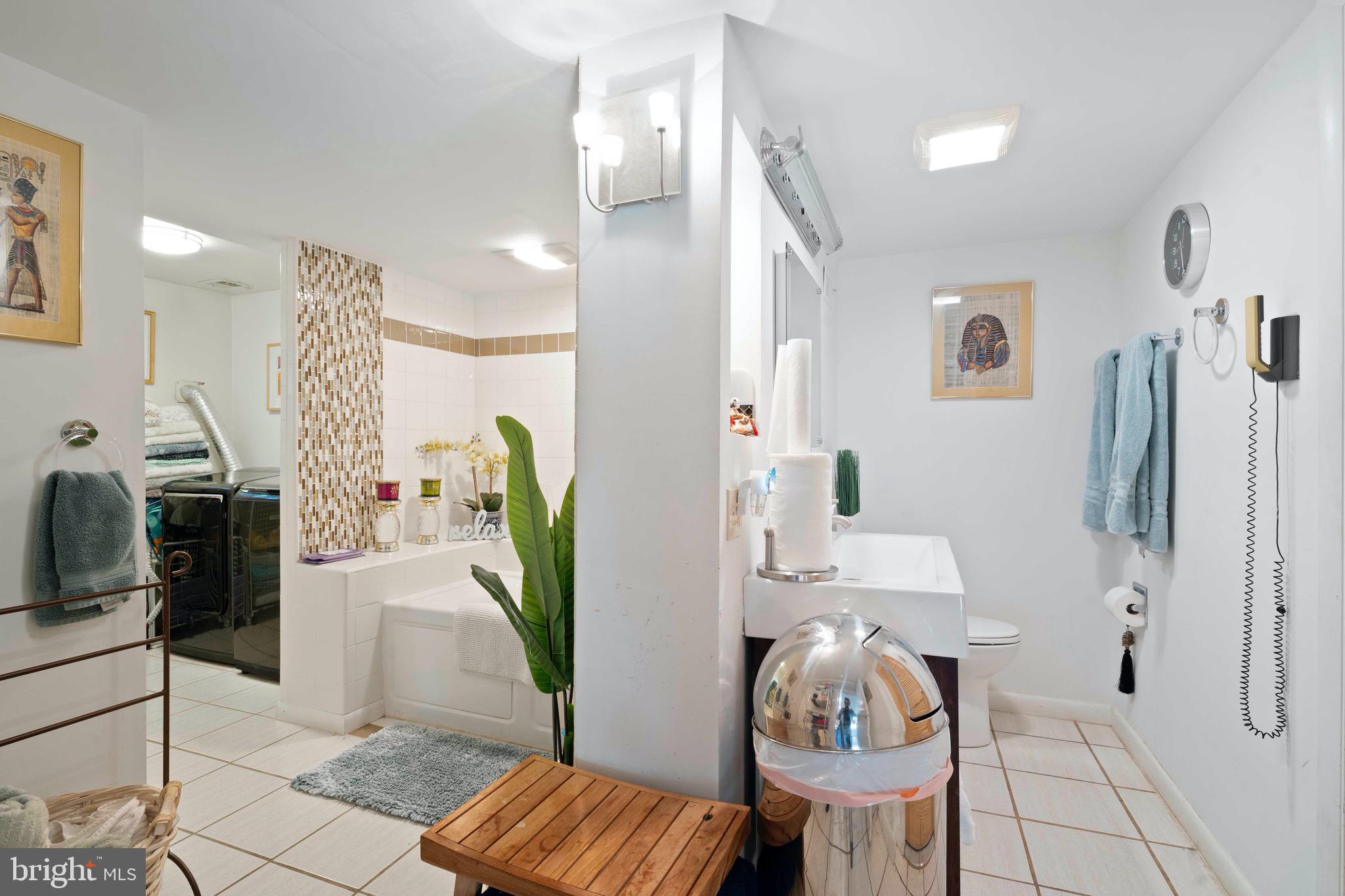10832 Margate Road Silver Spring, MD 20901 - Photo 25 of 31 a living room with furniture and a chandelier