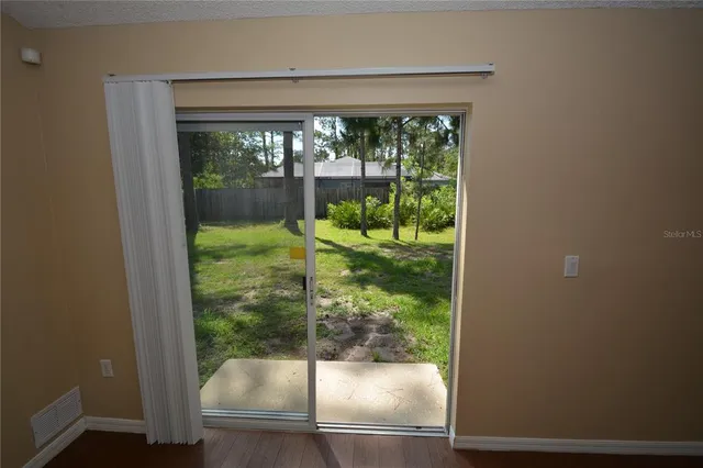a view of a glass door with a porch