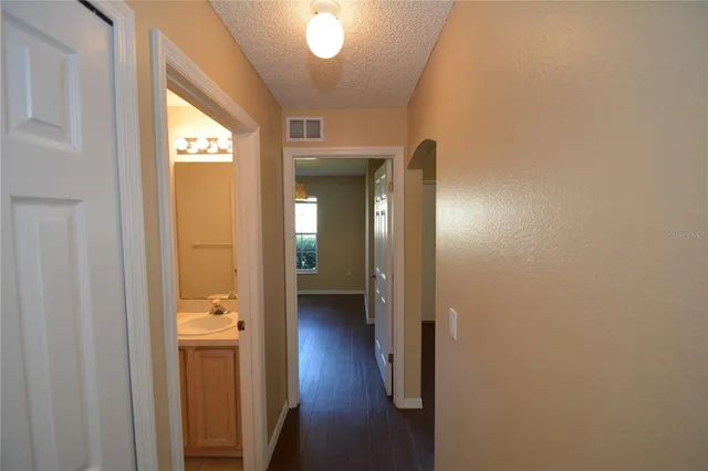 a view of a bathroom from a hallway