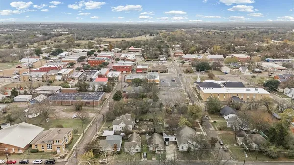 a aerial view of a residential apartment building with parking space