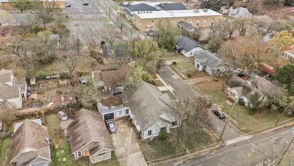 a aerial view of a house with a yard
