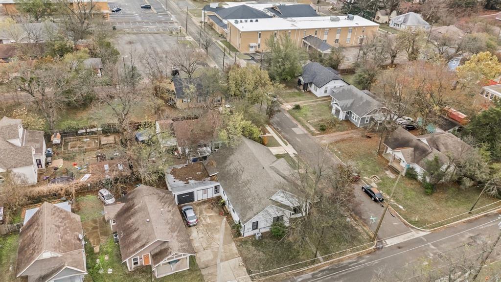 1406 Sycamore Street Commerce, TX 75428 - Photo 19 of 22 a aerial view of a residential apartment building with parking space