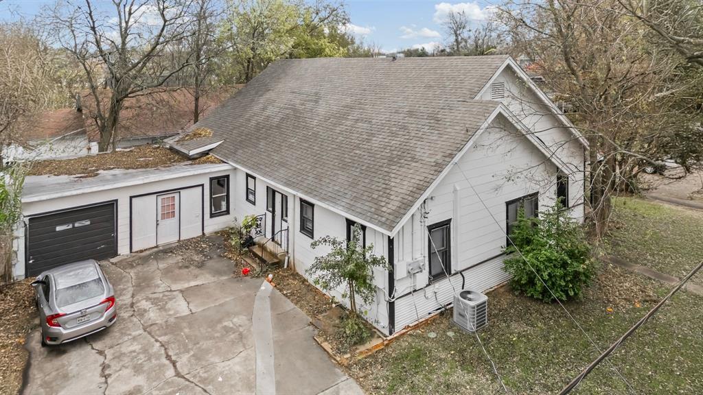 1406 Sycamore Street Commerce, TX 75428 - Photo 21 of 22 a aerial view of a house with a yard