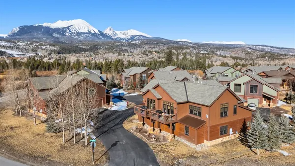 a view of a house with a mountain in the background