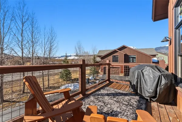a view of a balcony with wooden fence