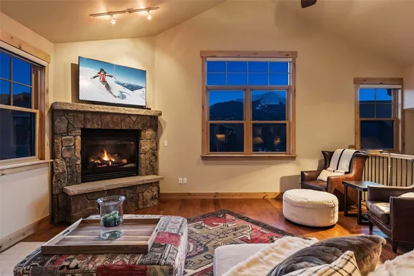 a bedroom with a bed and a fireplace