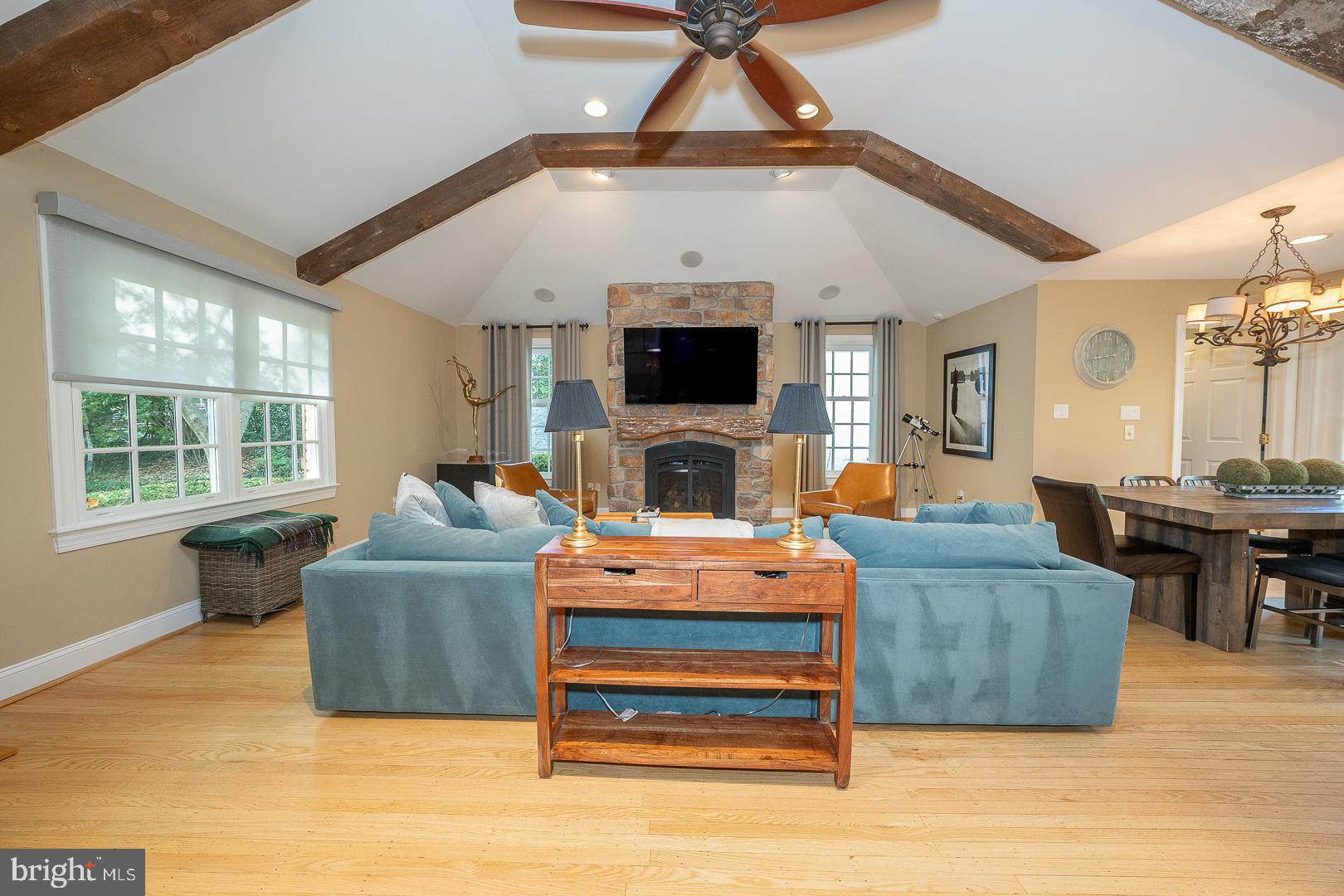 318 Chamounix Road Wayne, PA 19087 - Photo 17 of 55 a living room with furniture a flat screen tv and a fireplace