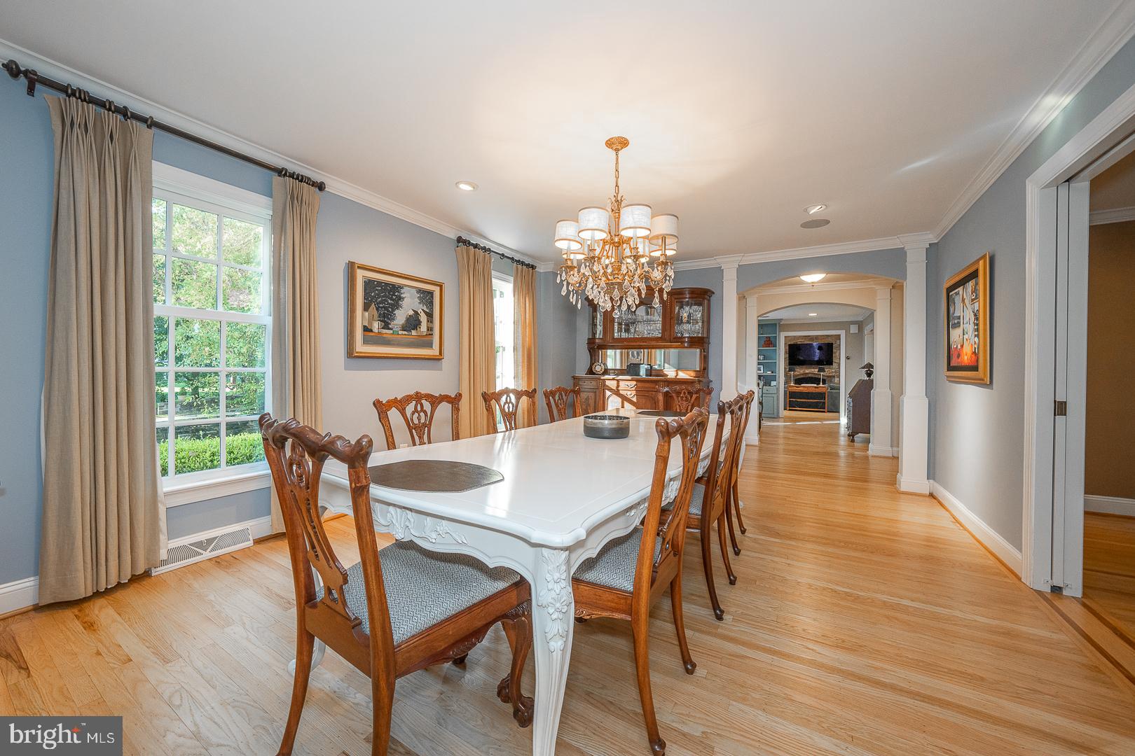 318 Chamounix Road Wayne, PA 19087 - Photo 18 of 55 a view of a dining room with furniture a chandelier and wooden floor