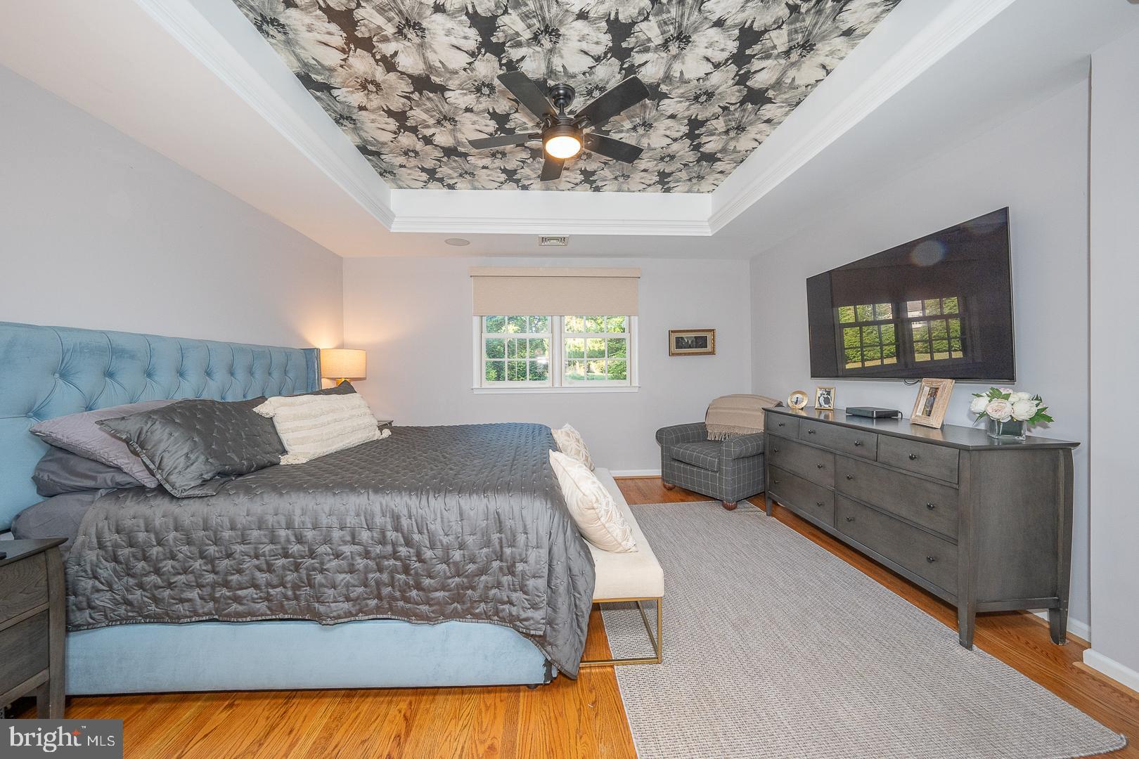 318 Chamounix Road Wayne, PA 19087 - Photo 27 of 55 a bedroom with a large bed and a flat screen tv