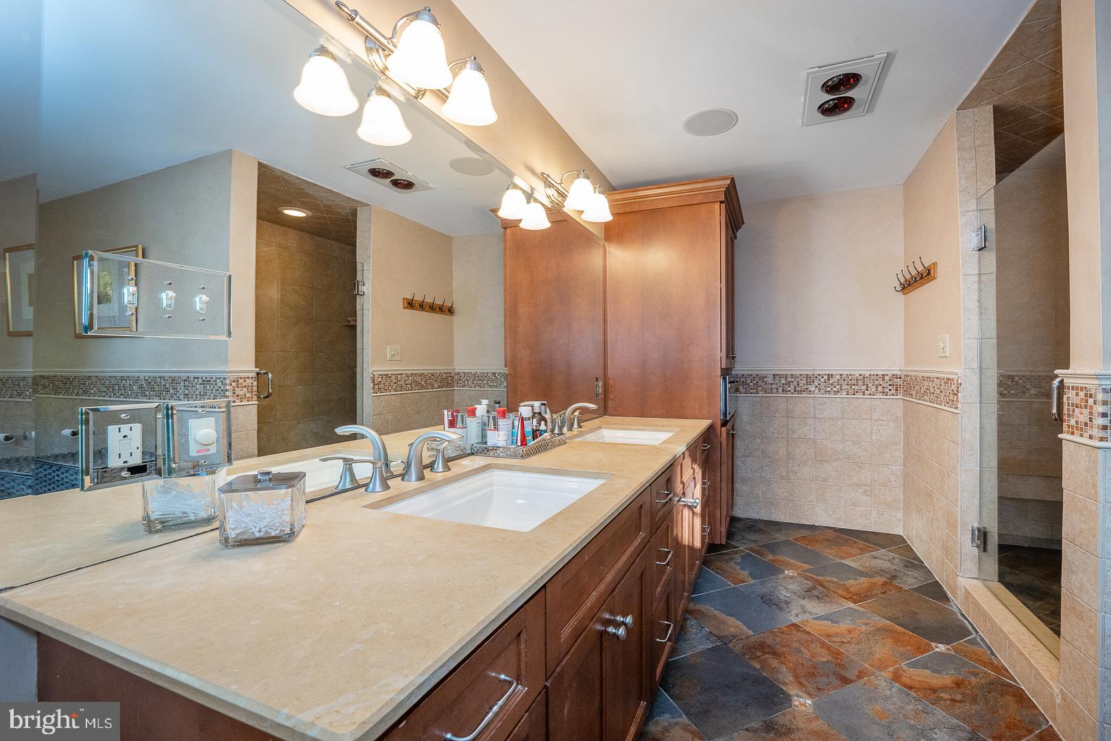 318 Chamounix Road Wayne, PA 19087 - Photo 31 of 55 a bathroom with a sink a vanity and a mirror