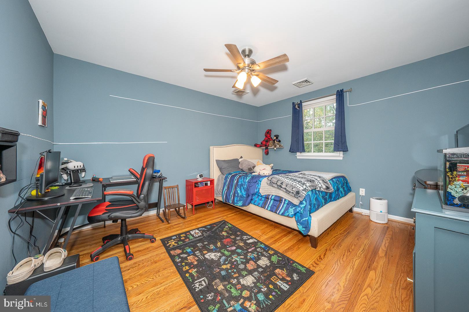 318 Chamounix Road Wayne, PA 19087 - Photo 35 of 55 a bedroom with furniture and a chandelier